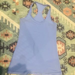 The tank top is a Lululemon tank top the color is a light purple